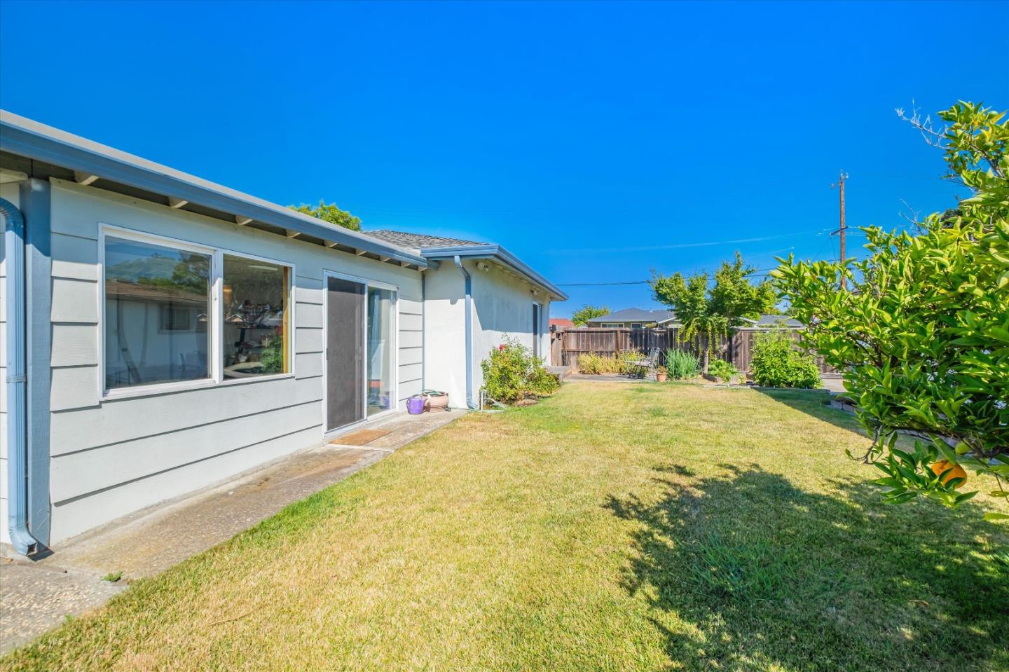6195 Rockrose Drive Newark, CA 94560 - Photo 21 of 24 a front view of a house with garden