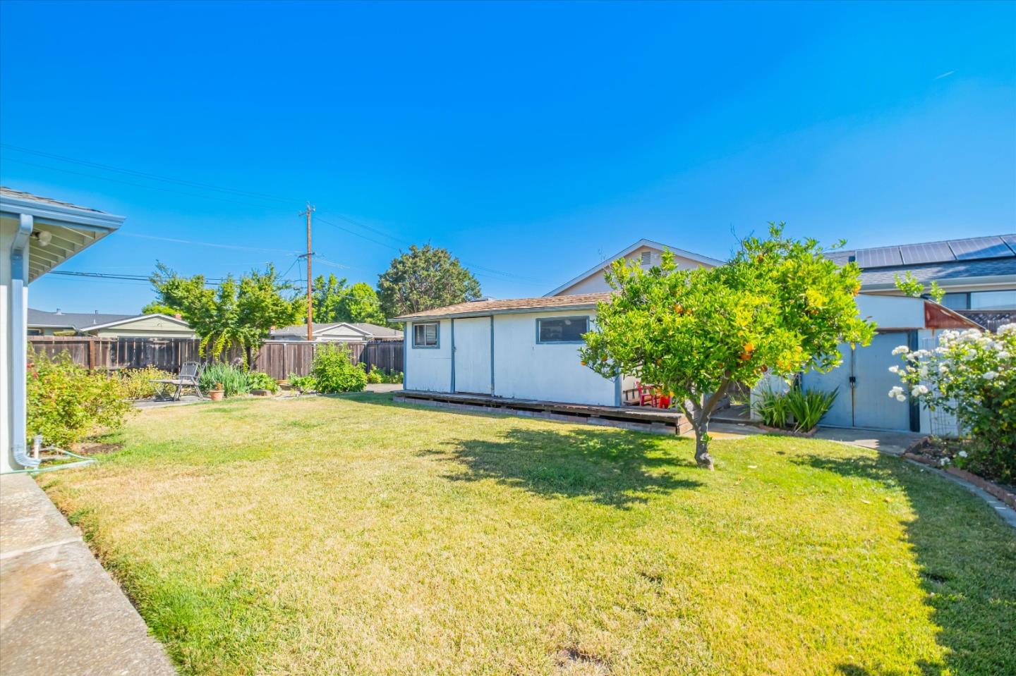 6195 Rockrose Drive Newark, CA 94560 - Photo 22 of 24 a view of a back yard of the house with a yard