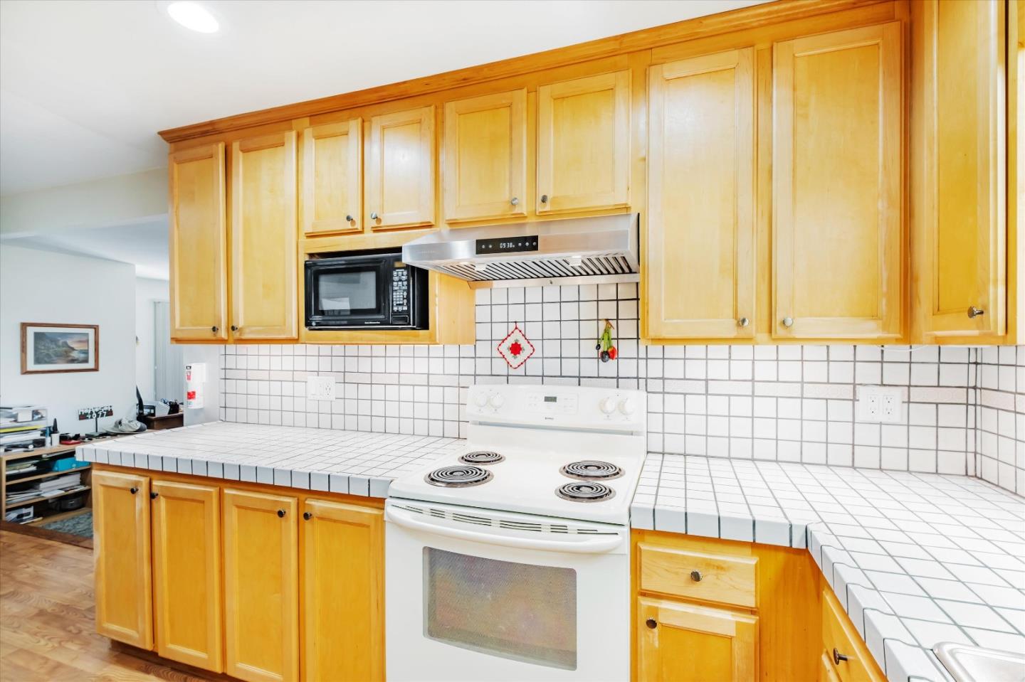 6195 Rockrose Drive Newark, CA 94560 - Photo 5 of 24 a kitchen with stainless steel appliances a stove a sink and a microwave