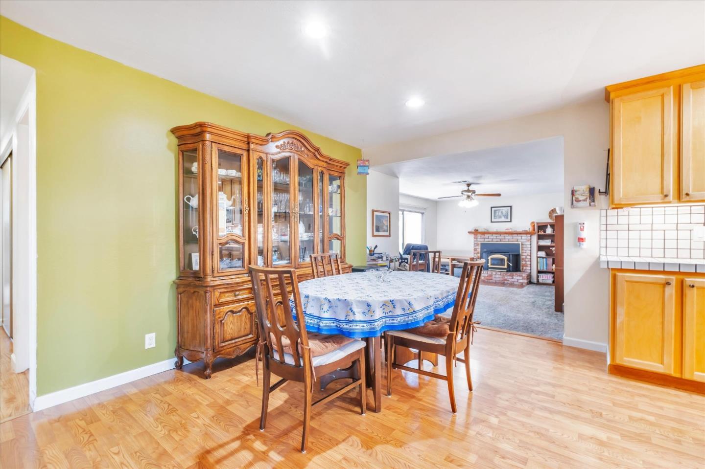 6195 Rockrose Drive Newark, CA 94560 - Photo 6 of 24 a view of a dining room with furniture and a fireplace
