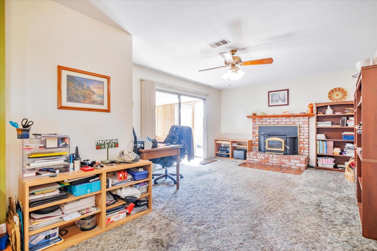 6195 Rockrose Drive Newark, CA 94560 - Photo 7 of 24 a living room with furniture and a fireplace