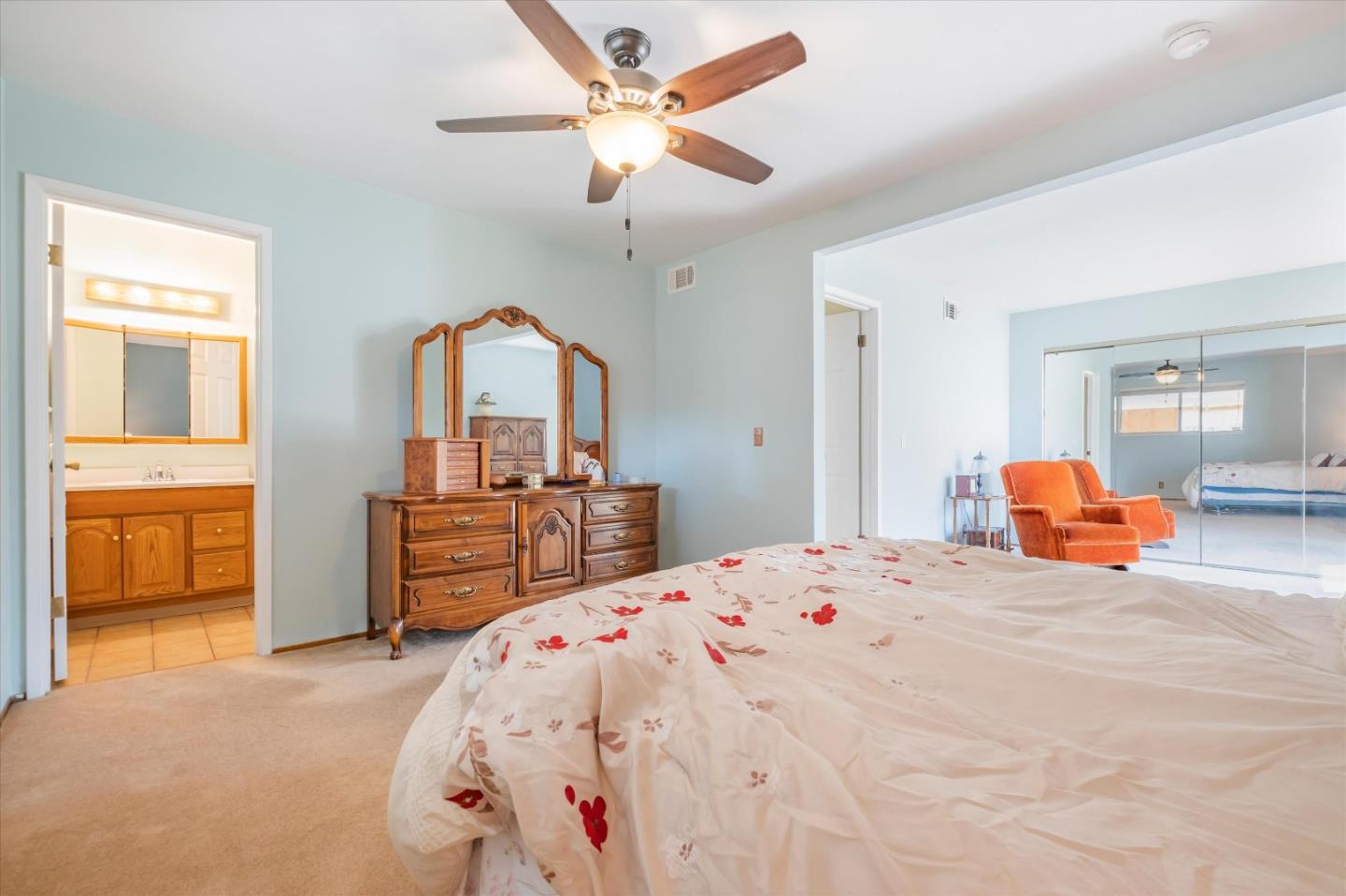 6195 Rockrose Drive Newark, CA 94560 - Photo 9 of 24 a bedroom with a bed and dresser with mirror