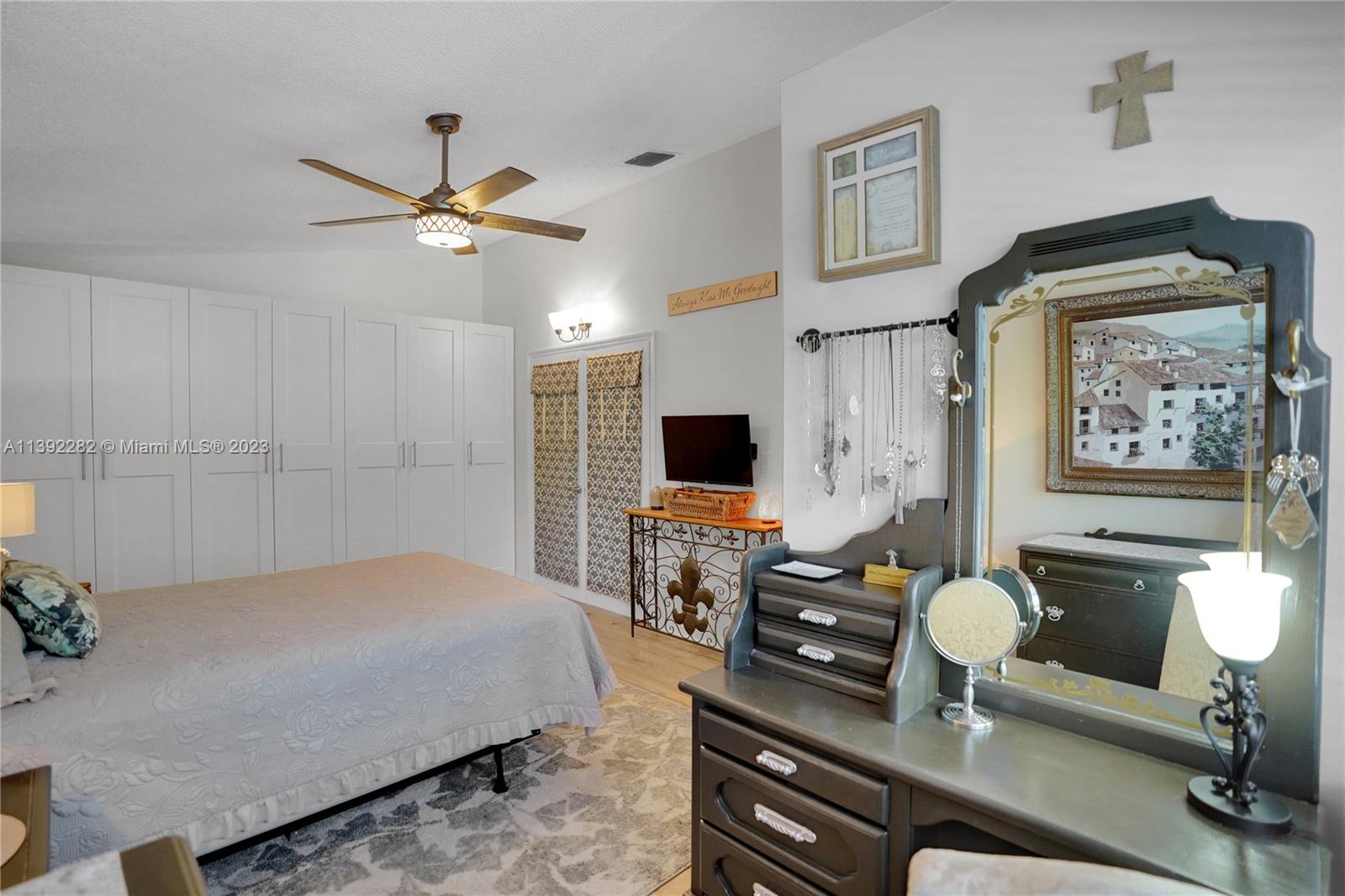 3850 Tree Top Road Cooper City, FL 33026 - Photo 20 of 34 a bedroom with a bed and furniture