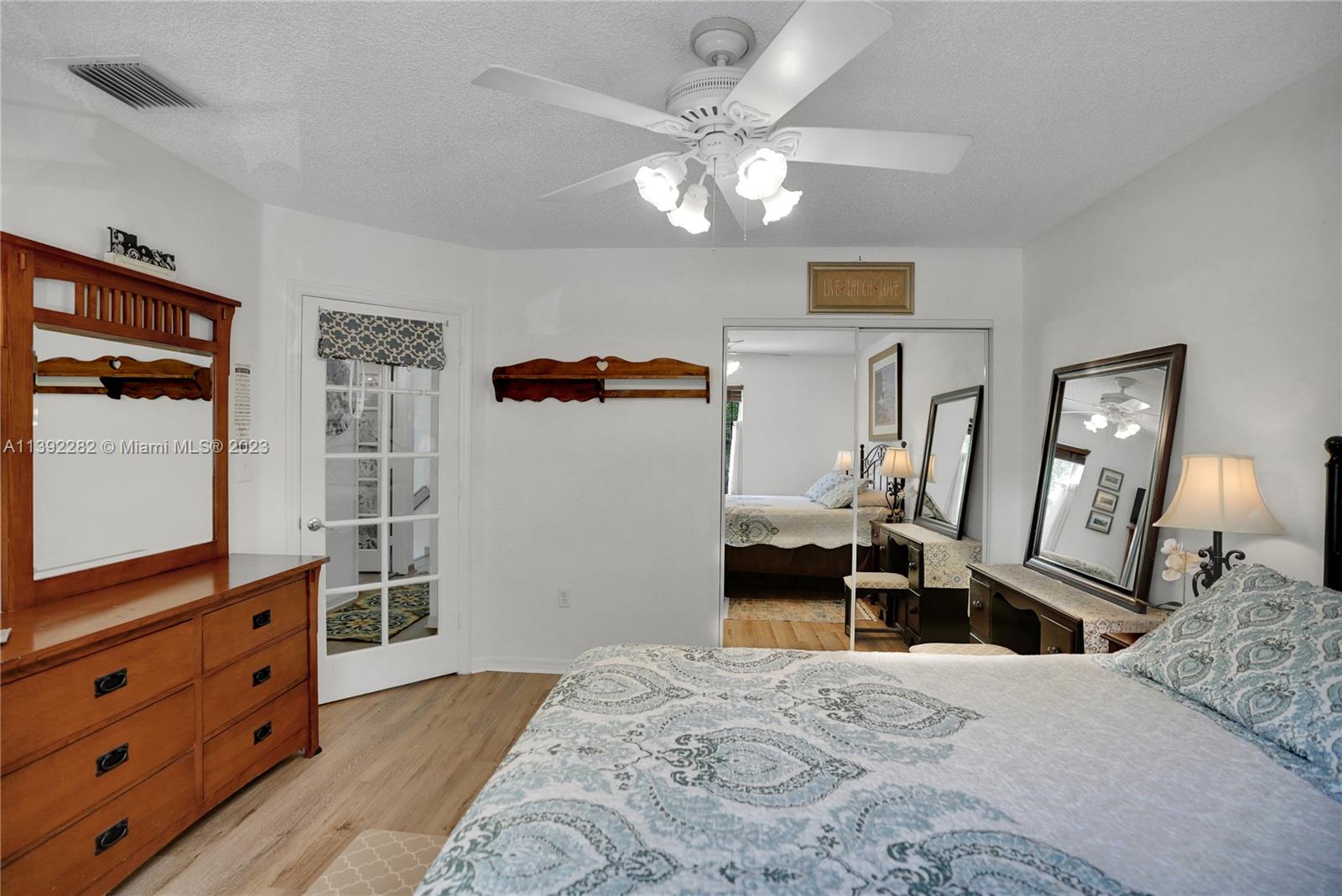3850 Tree Top Road Cooper City, FL 33026 - Photo 27 of 34 a bedroom with a bed and wooden floor