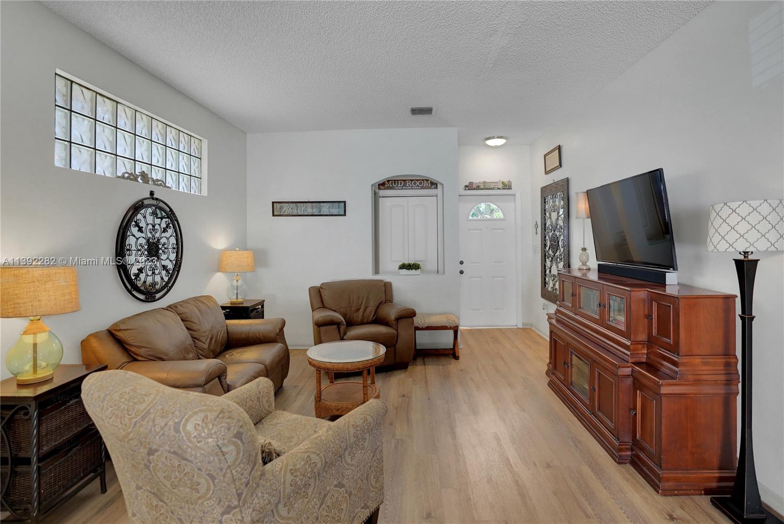 3850 Tree Top Road Cooper City, FL 33026 - Photo 5 of 34 a living room with furniture and a flat screen tv