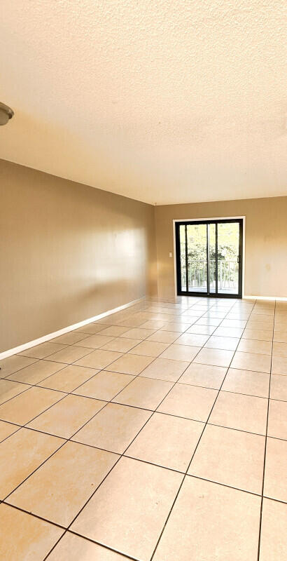 814 North G Street, Unit 1 Lake Worth Beach, FL 33460 - Photo 4 of 5 a view of an empty room and window