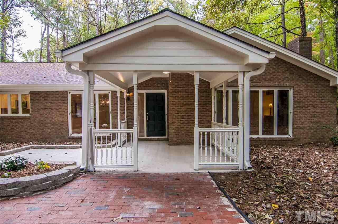 8828 Stage Ford Road Raleigh, NC 27615 - Photo 14 of 25 a front view of a house with a yard