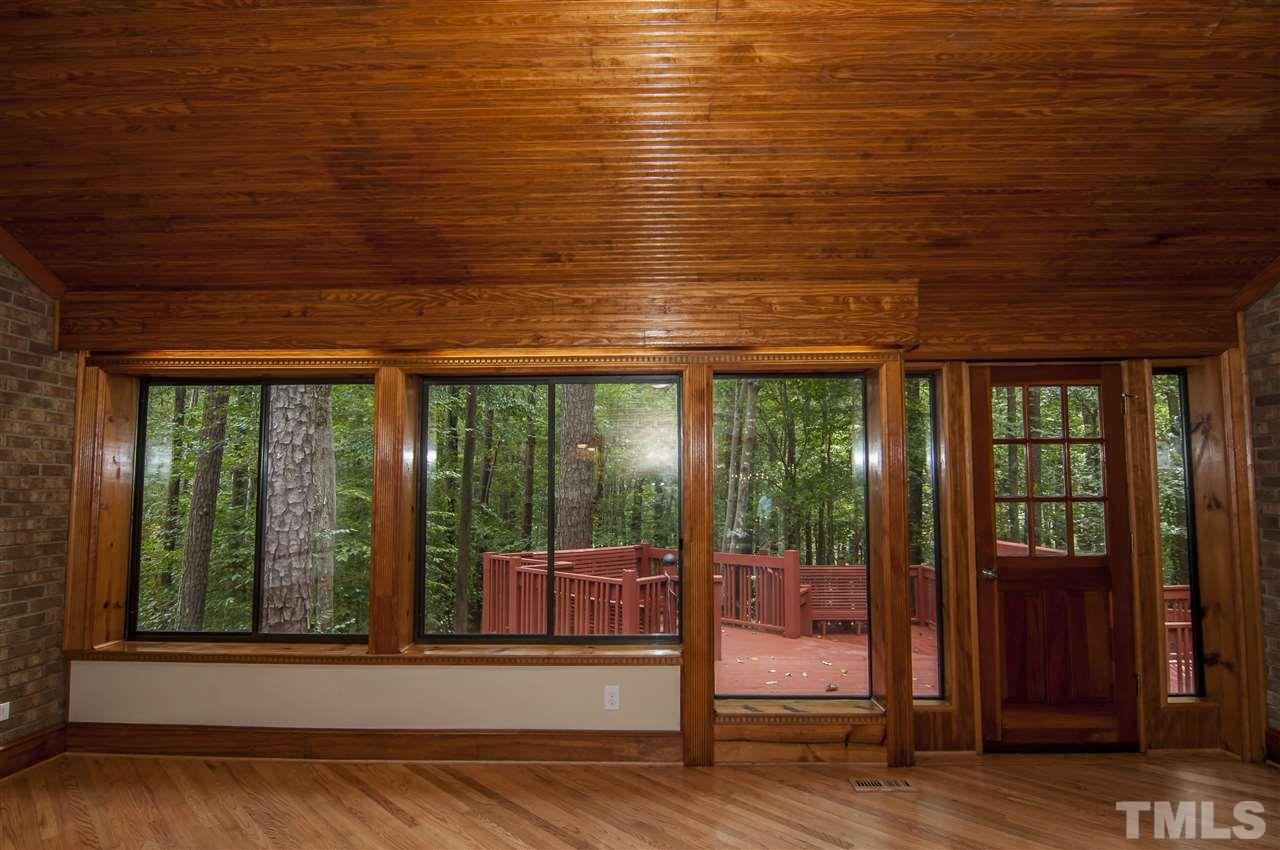8828 Stage Ford Road Raleigh, NC 27615 - Photo 3 of 25 a view of a room with wooden floor and windows