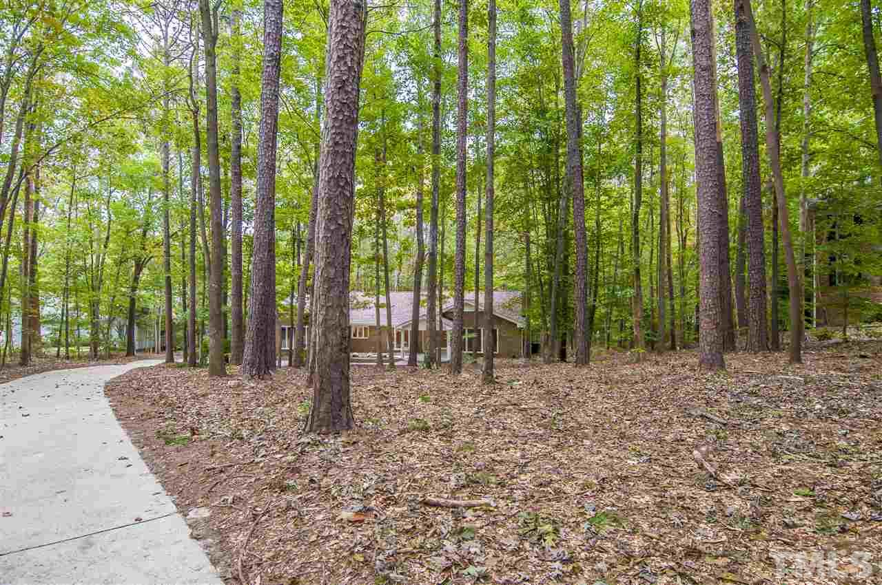 8828 Stage Ford Road Raleigh, NC 27615 - Photo 5 of 25 a view of a backyard with trees