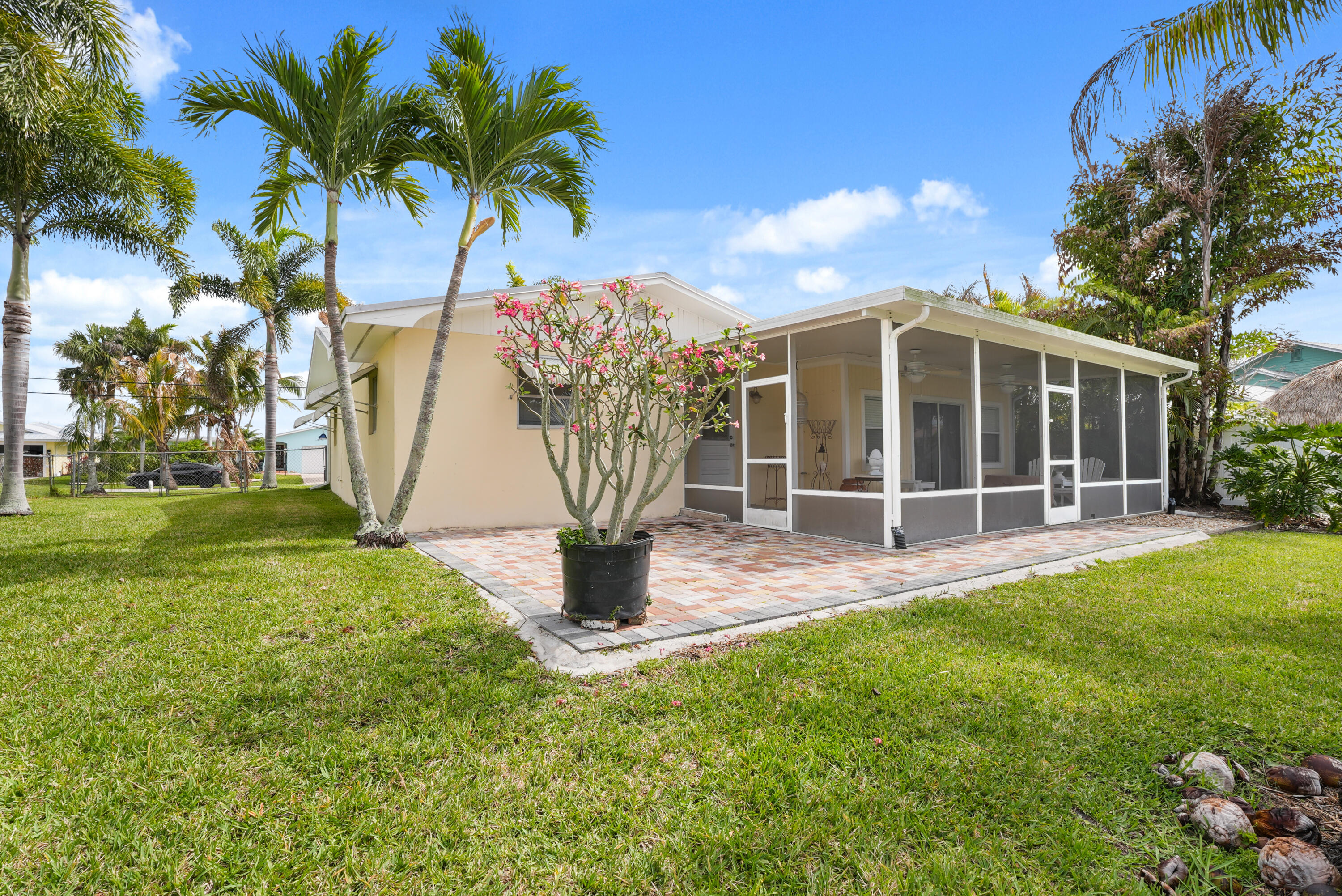 1459 Southwest Seahawk Way Palm City, FL 34990 - Photo 37 of 43 a view of a house with backyard and sitting area