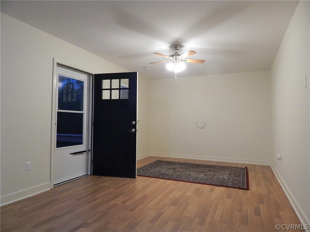 17201 Parsons Road Beaverdam, VA 23015 - Photo 2 of 19 wooden floor in an empty room with a window