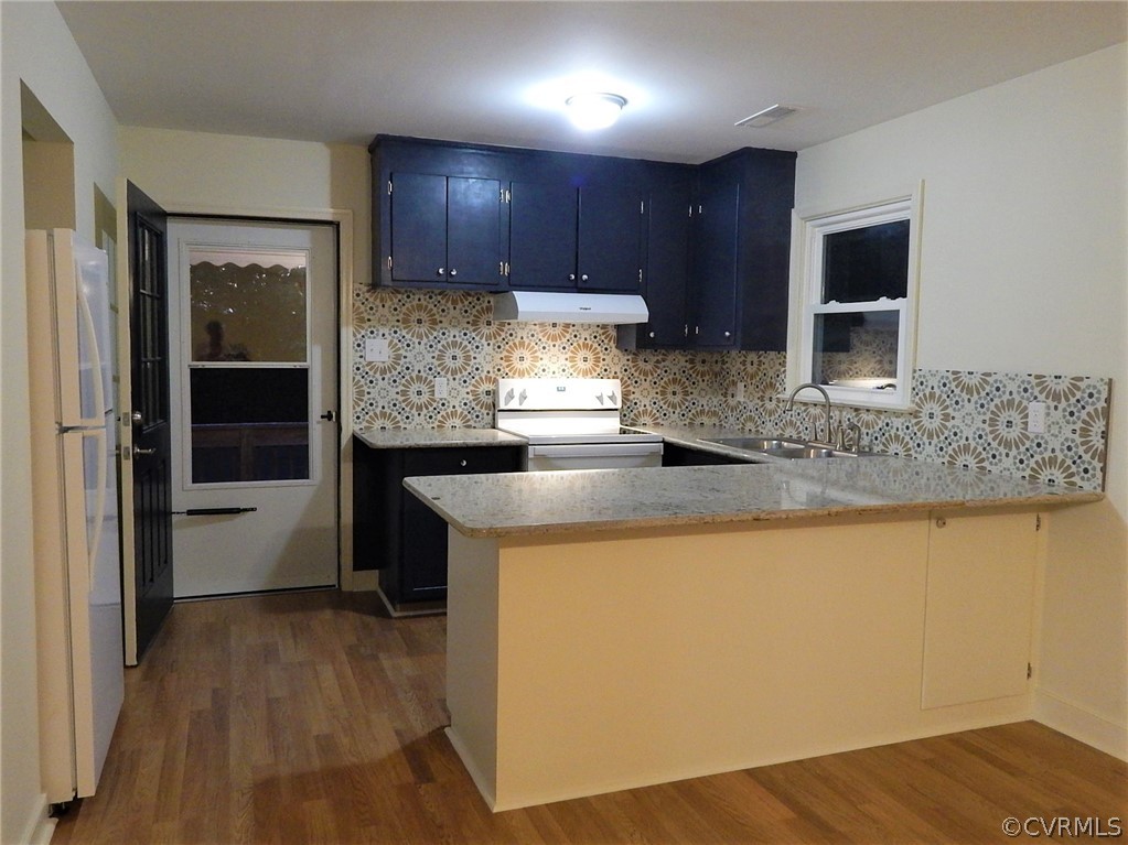 17201 Parsons Road Beaverdam, VA 23015 - Photo 3 of 19 a kitchen with kitchen island granite countertop wooden cabinets and a counter top space