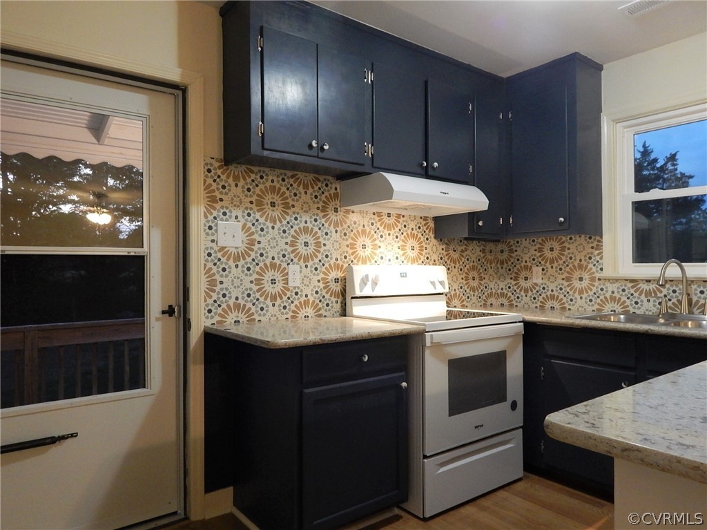 17201 Parsons Road Beaverdam, VA 23015 - Photo 4 of 19 a kitchen with stainless steel appliances granite countertop wooden cabinets and a stove