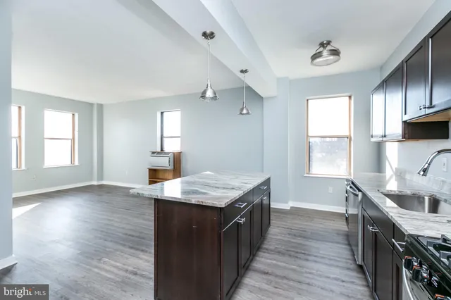 a view of kitchen sink and granite counter top