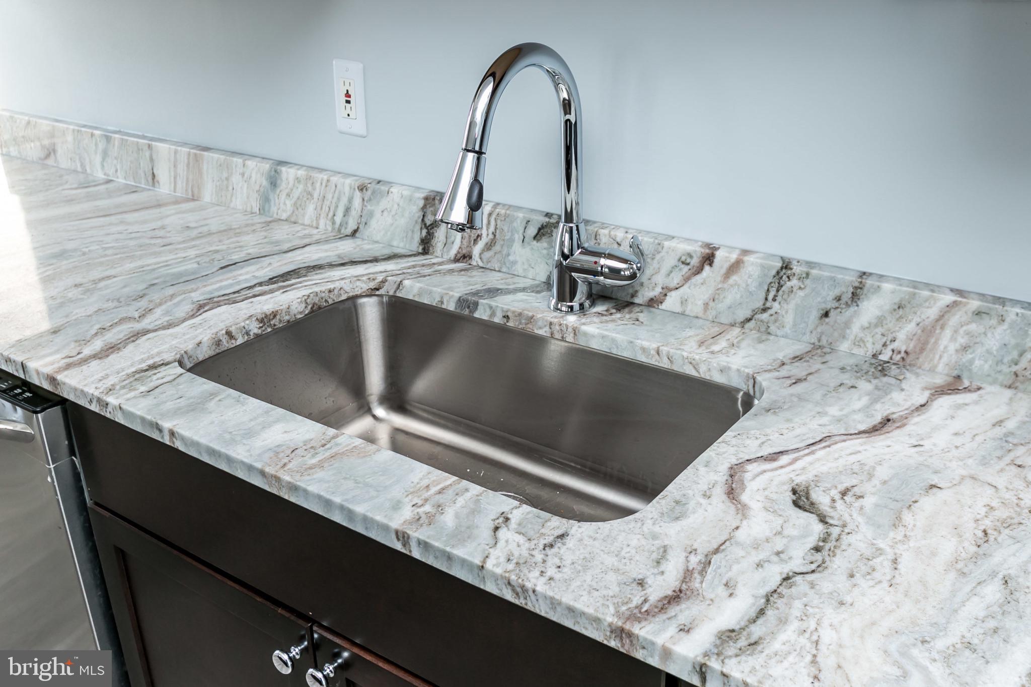 1001 St Paul Street, Unit 6G Baltimore, MD 21202 - Photo 14 of 32 a view of kitchen sink and granite counter top