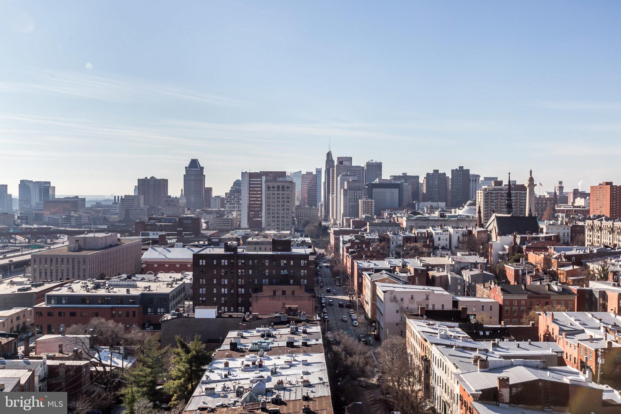 1001 St Paul Street, Unit 6G Baltimore, MD 21202 - Photo 26 of 32 a city view with tall buildings
