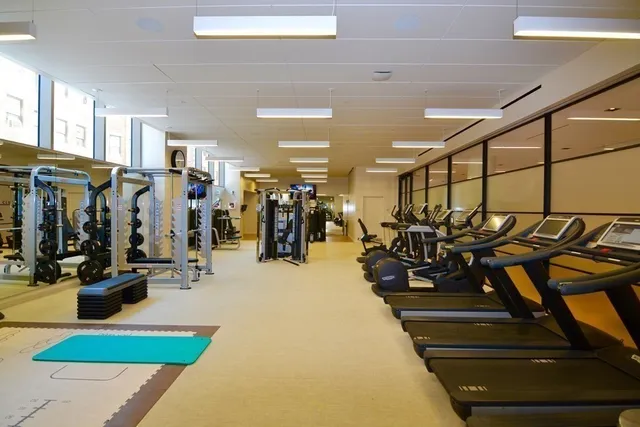 a view of a balcony with floor to ceiling windows with wooden floor