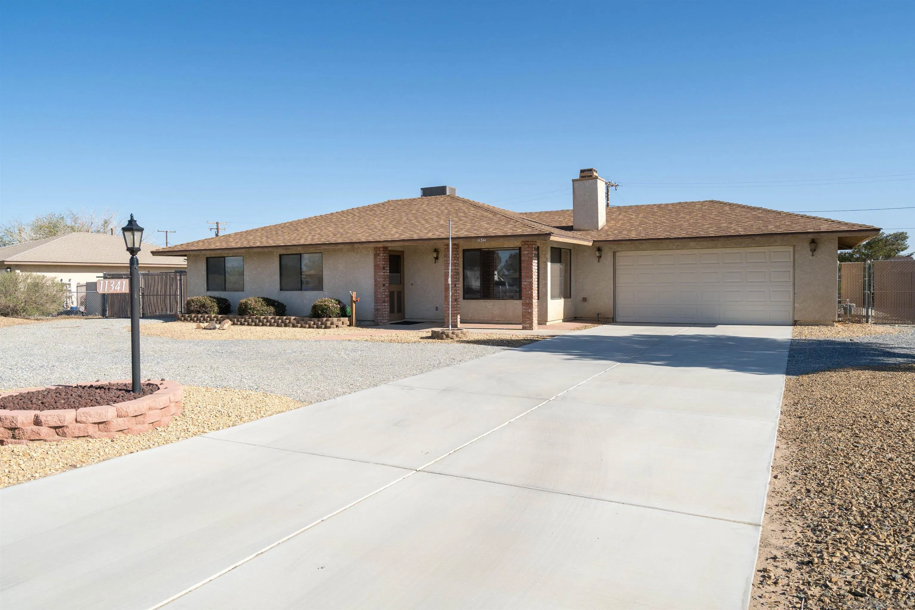 11341 Chimayo Road Apple Valley, CA 92308 - Photo 1 of 27 a front view of a building with street view