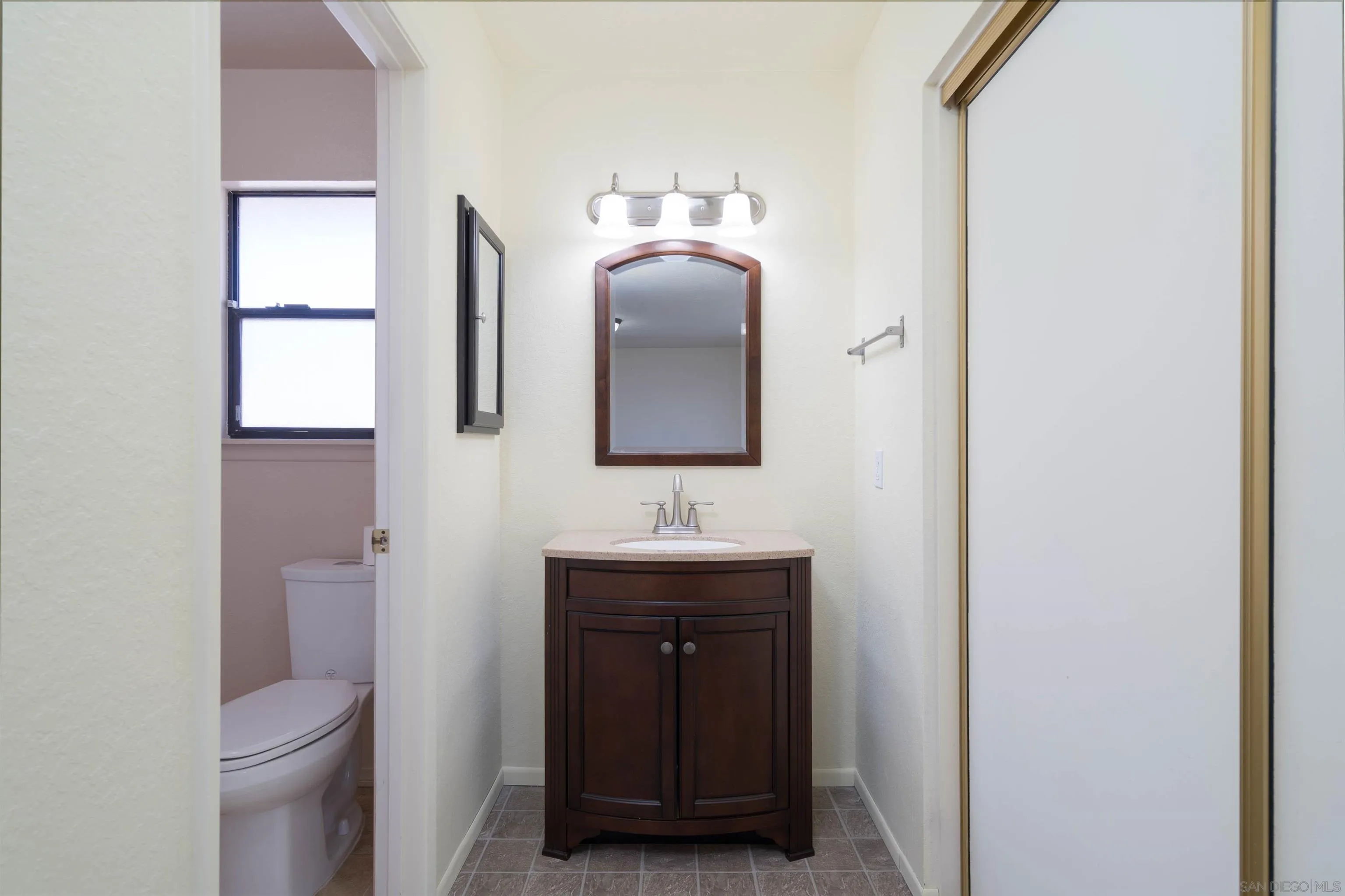 11341 Chimayo Road Apple Valley, CA 92308 - Photo 16 of 27 a bathroom with a sink and a mirror