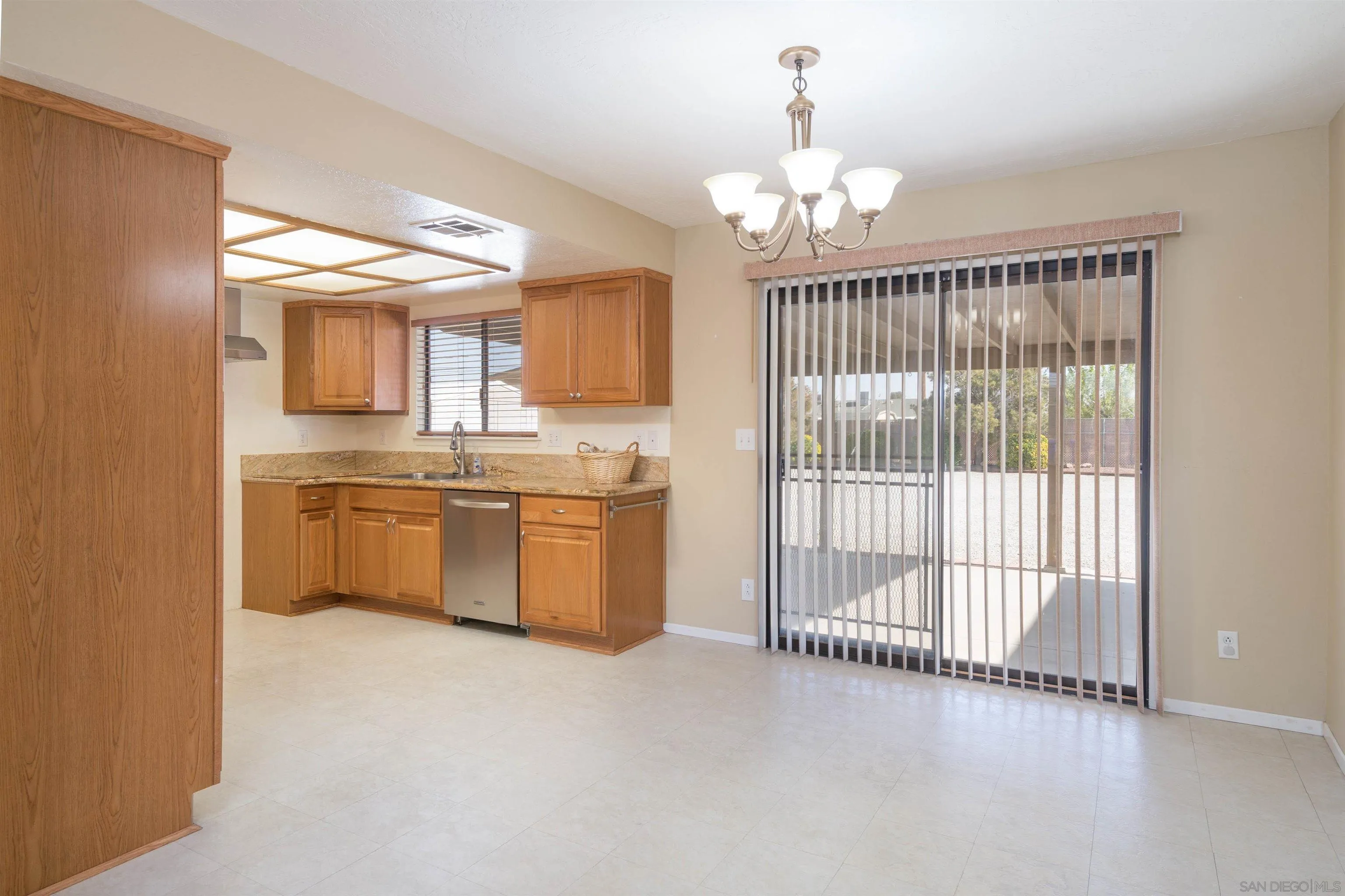 11341 Chimayo Road Apple Valley, CA 92308 - Photo 4 of 27 a view of a kitchen with cabinets and wooden floor