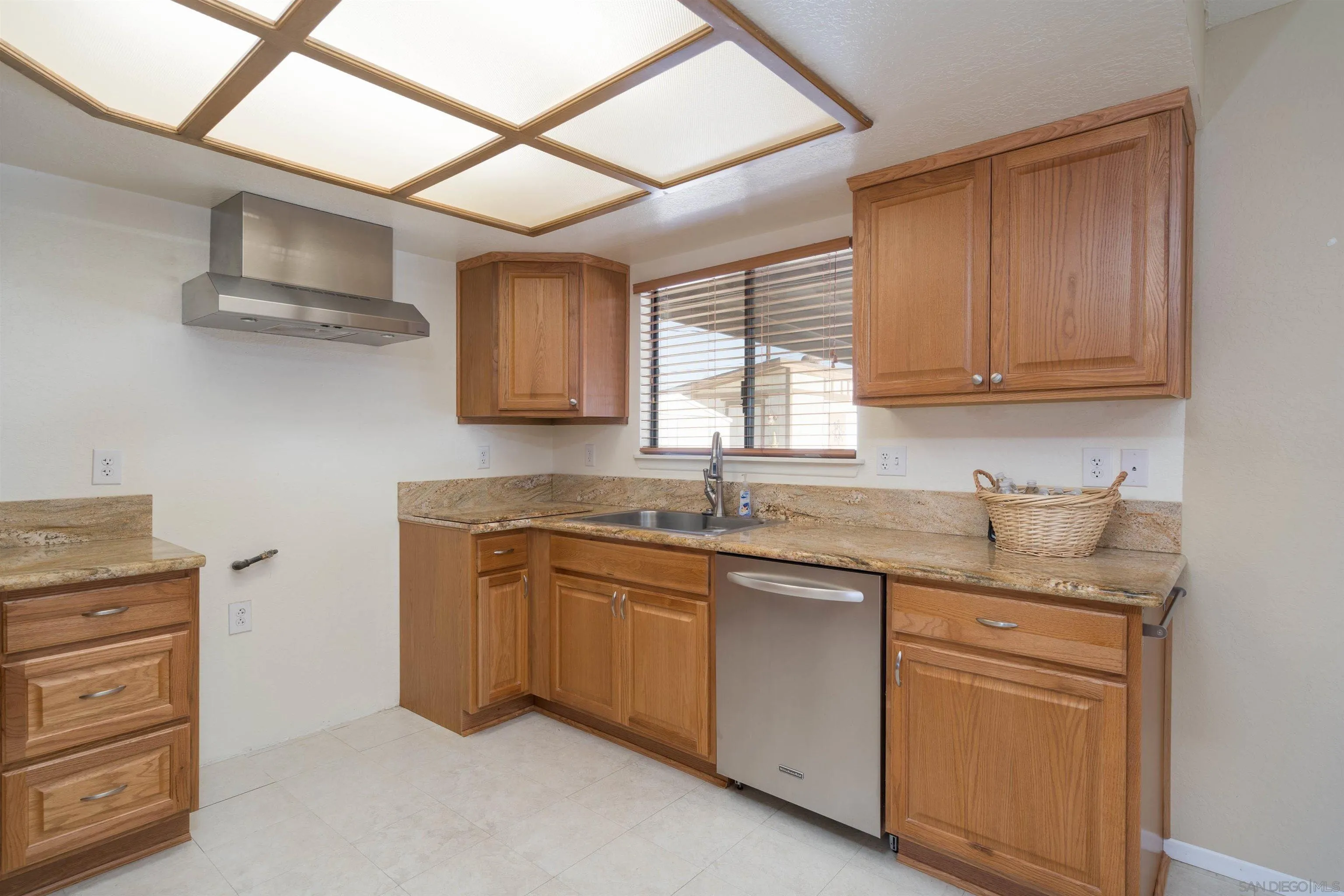 11341 Chimayo Road Apple Valley, CA 92308 - Photo 6 of 27 a kitchen with cabinets appliances a sink and a window