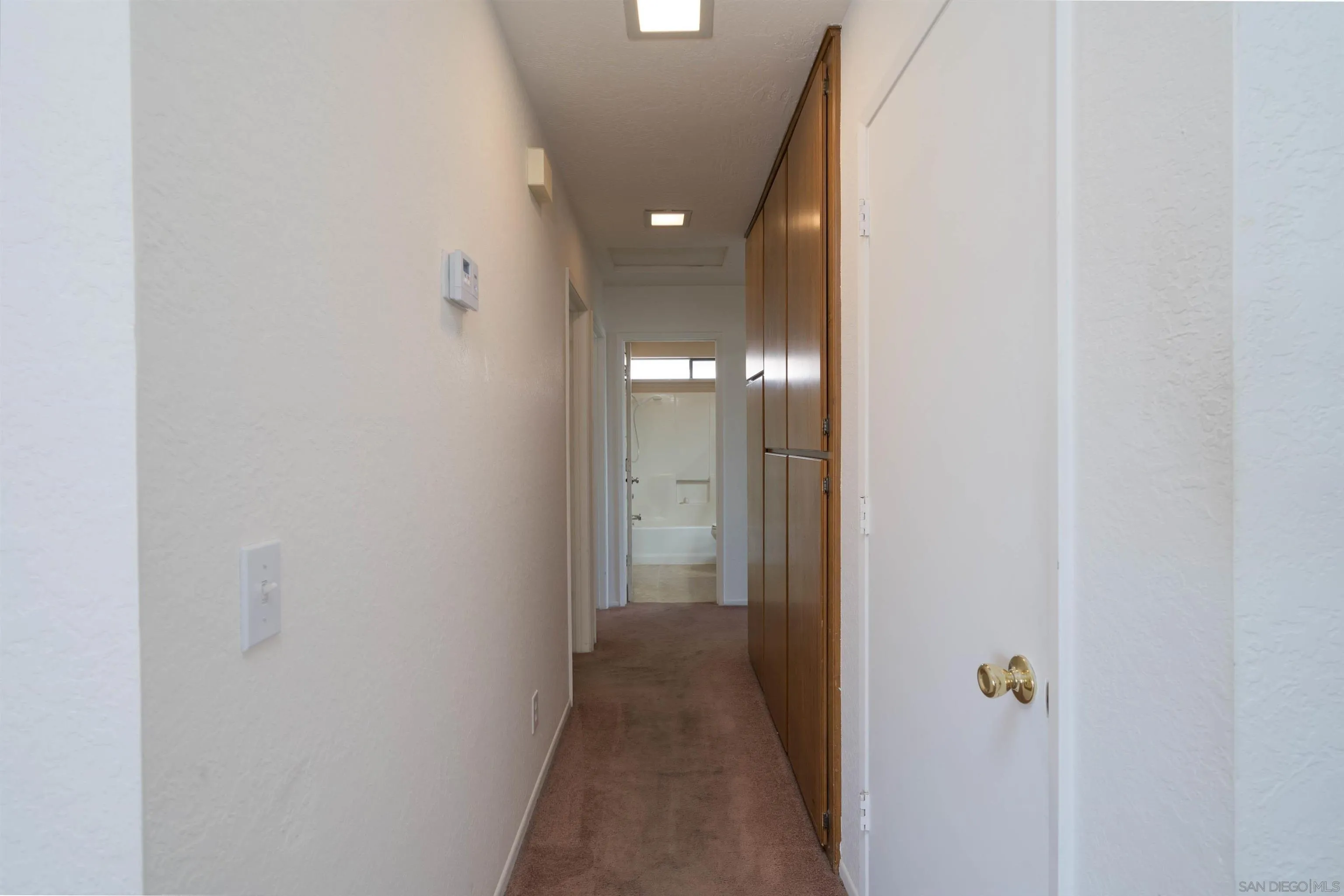 11341 Chimayo Road Apple Valley, CA 92308 - Photo 8 of 27 a view of a hallway with wooden floor