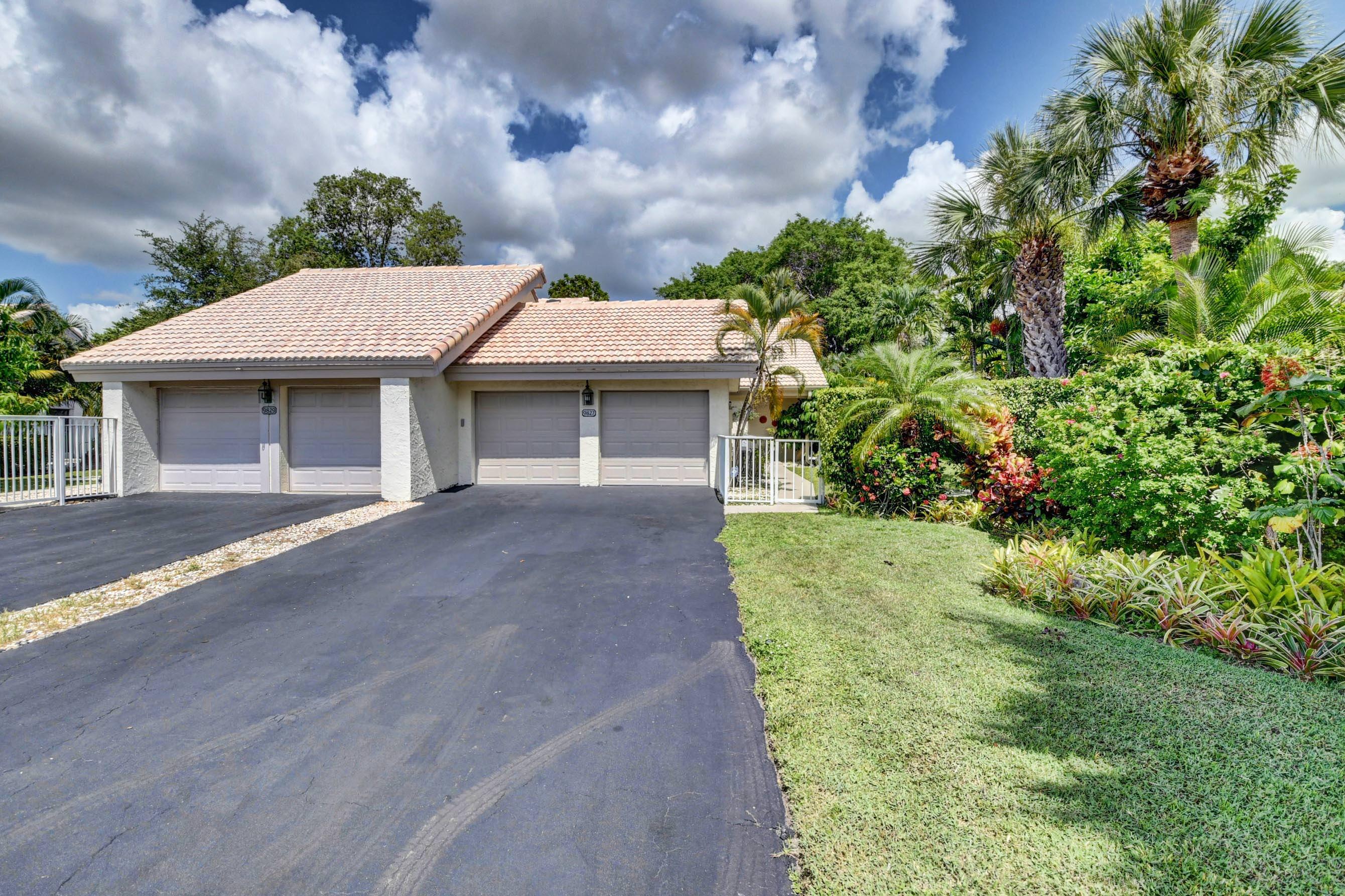 9827 Erica Court Boca Raton, FL 33496 - Photo 1 of 29 TWO CAR GARAGE WITH EXTENDED DRIVEWAY