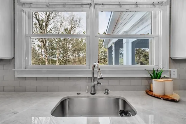 a bathroom with a sink vanity and a mirror