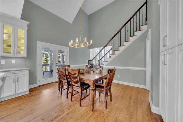 a room with gym equipment and view kitchen