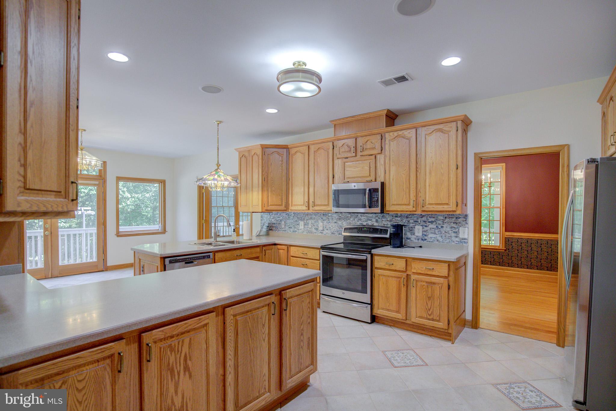 813 Blacks Hill Road Great Falls, VA 22066 - Photo 27 of 92 Kitchen with view to Formal Dining Room