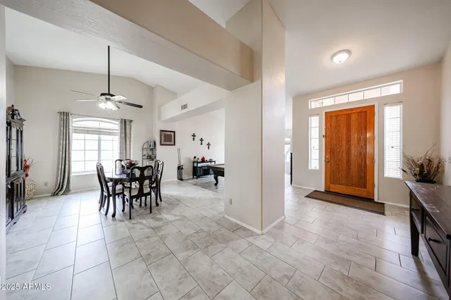 a view of a dining room with furniture and window