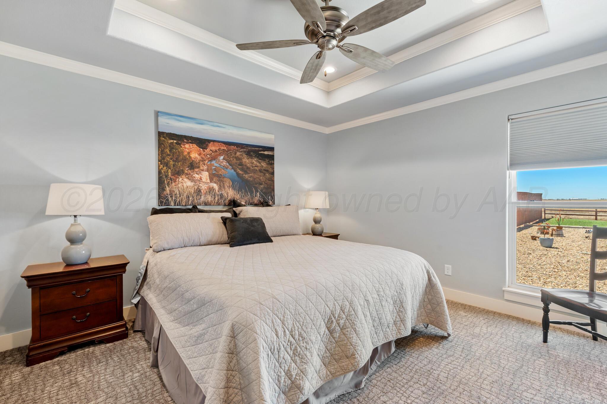 6550 Arnot Road Amarillo, TX 79119 - Photo 15 of 19 a bedroom with a bed and a window