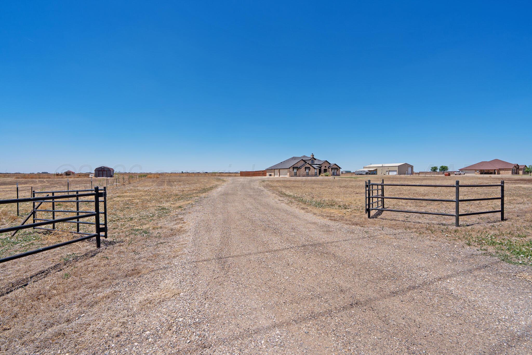 6550 Arnot Road Amarillo, TX 79119 - Photo 4 of 19 a view of a dry yard with a bench