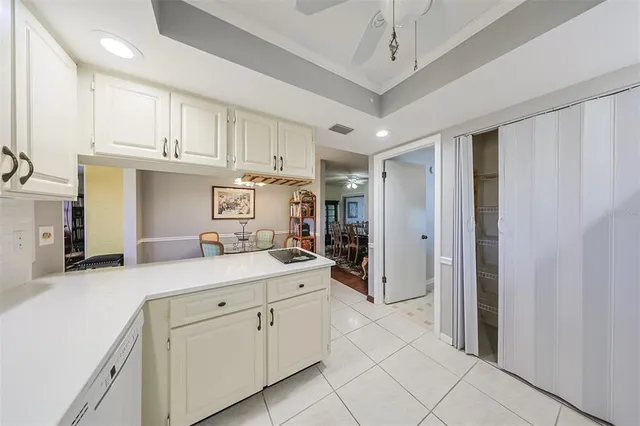 a bathroom with a granite countertop sink mirror and shower