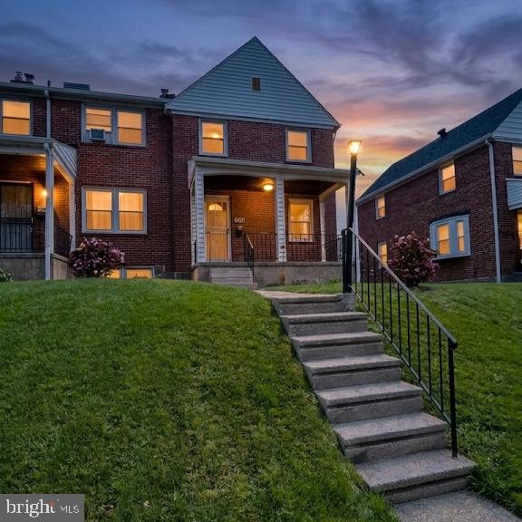 1550 Pentwood Road Baltimore, MD 21239 - Photo 1 of 29 a front view of a house with a yard