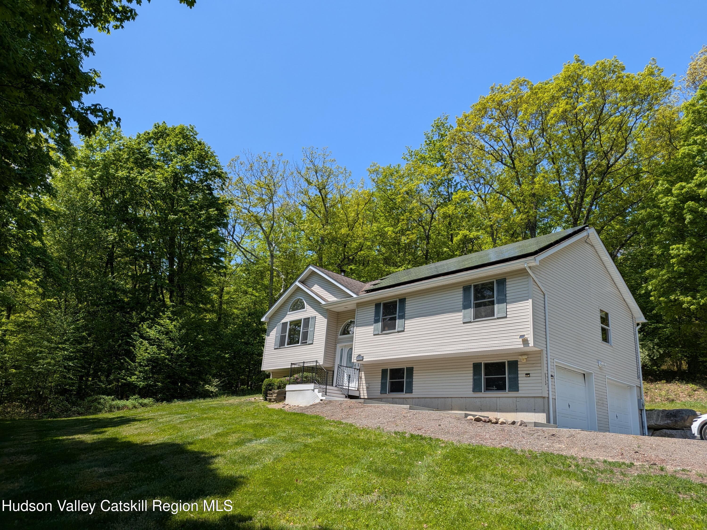 513 South Mountain Road Gardiner, NY 12525 - Photo 51 of 63 a view of a white house with a big yard and potted plants