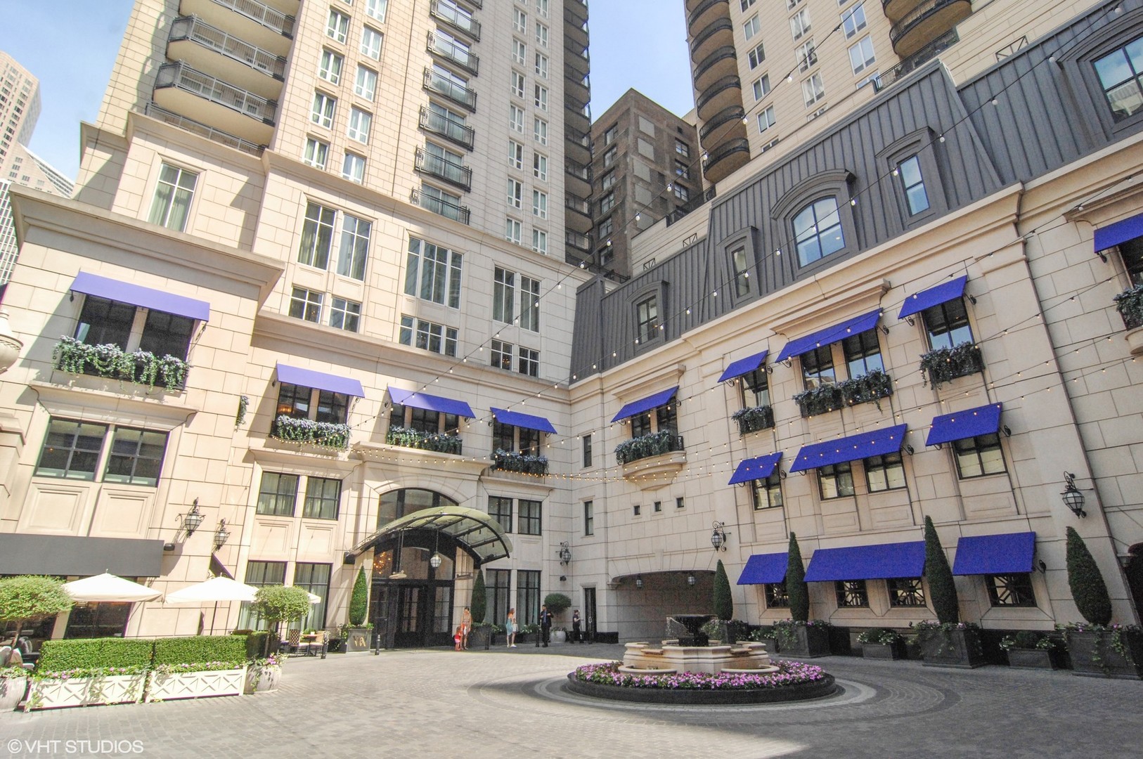 11 East Walton Street, Unit 4202 Chicago, IL 60611 - Photo 1 of 48 a front view of multi story residential apartment building with retail shops