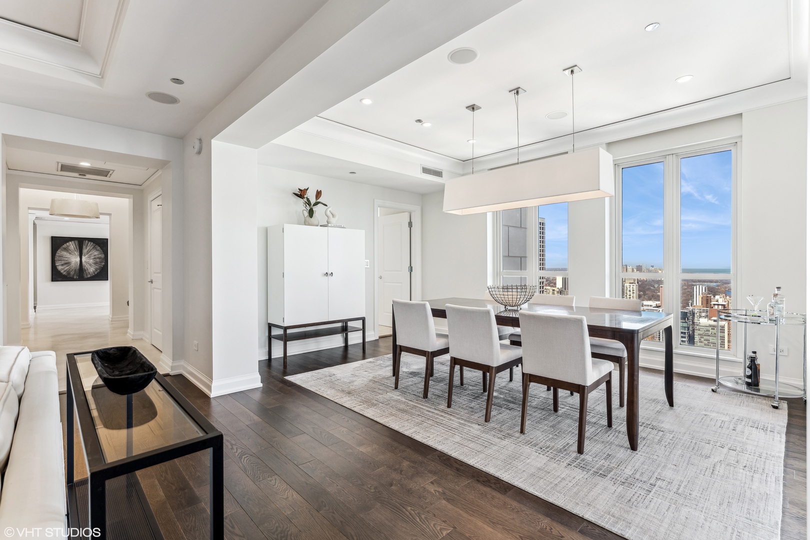 11 East Walton Street, Unit 4202 Chicago, IL 60611 - Photo 11 of 48 a view of a dining room with furniture and wooden floor