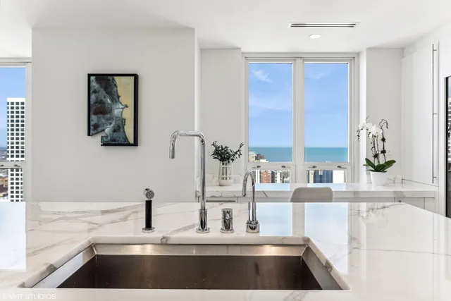 a kitchen with a faucet a sink and a window