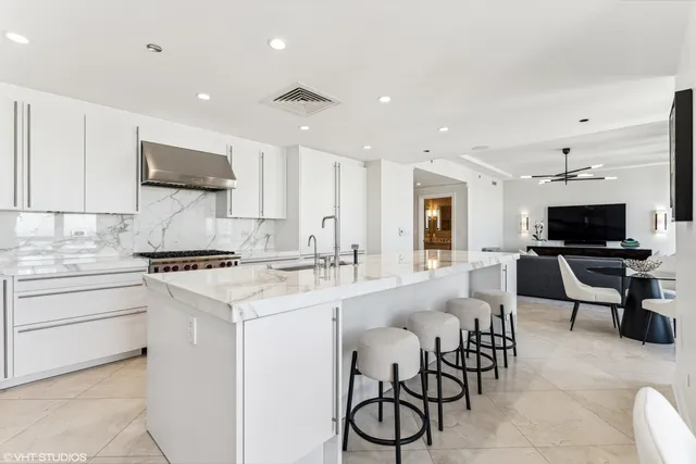 a kitchen with appliances a sink and cabinets