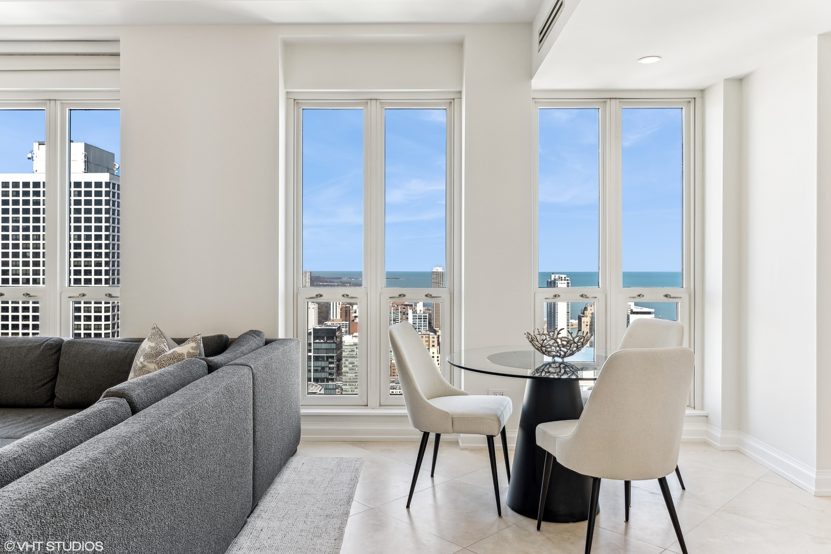 11 East Walton Street, Unit 4202 Chicago, IL 60611 - Photo 18 of 48 a living room with furniture and a large window