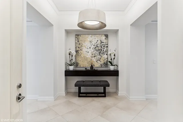 a living room with furniture and a wall painting