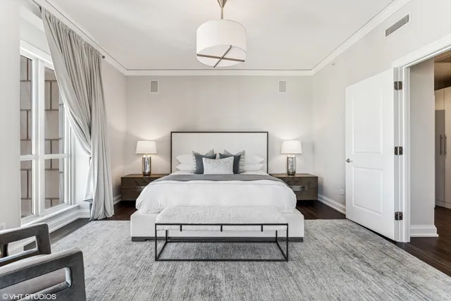 a bedroom with a bed and window