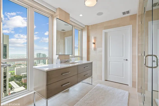 a bathroom with a double vanity sink and a mirror