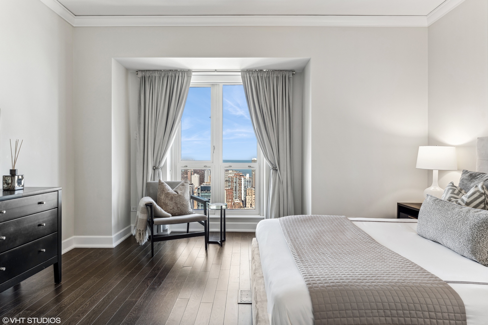 11 East Walton Street, Unit 4202 Chicago, IL 60611 - Photo 32 of 48 a bedroom with a bed and a large window