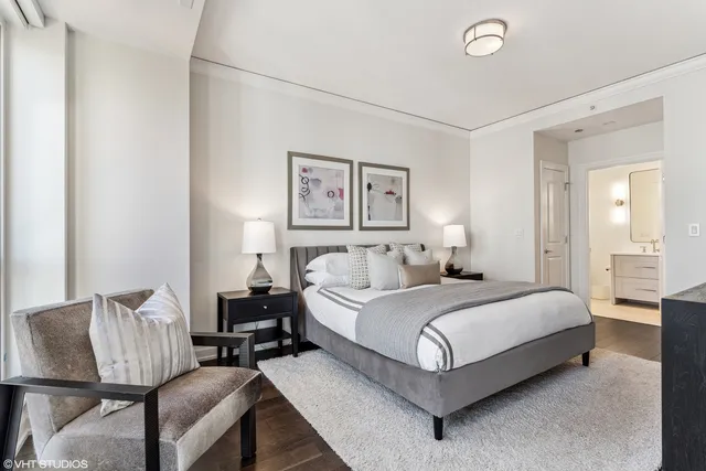 a bedroom with a bed and furniture