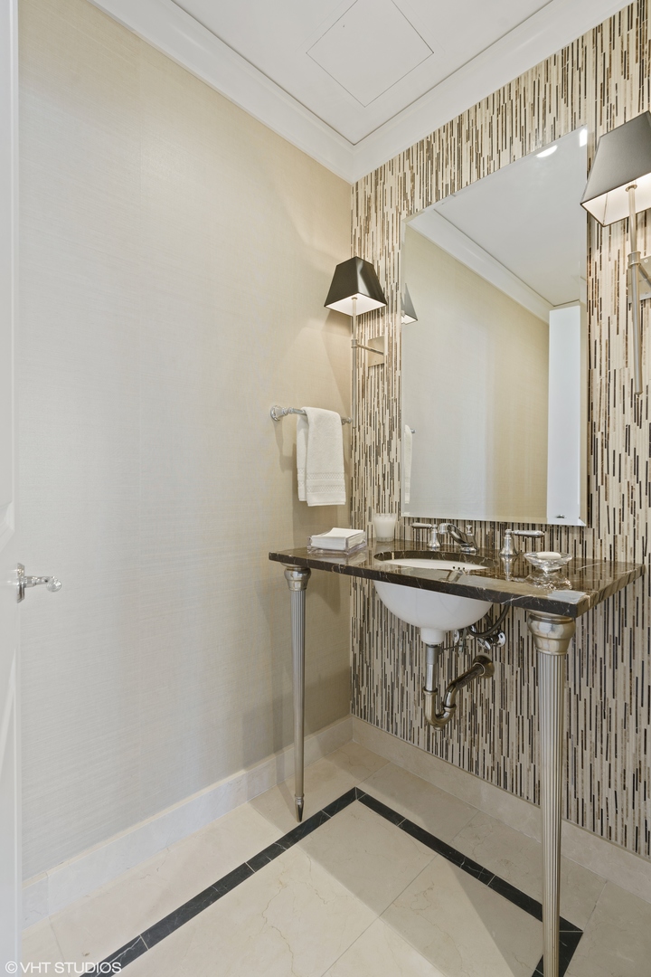 11 East Walton Street, Unit 4202 Chicago, IL 60611 - Photo 37 of 48 a view of a hallway with windows