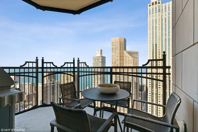 a view of a balcony with chairs