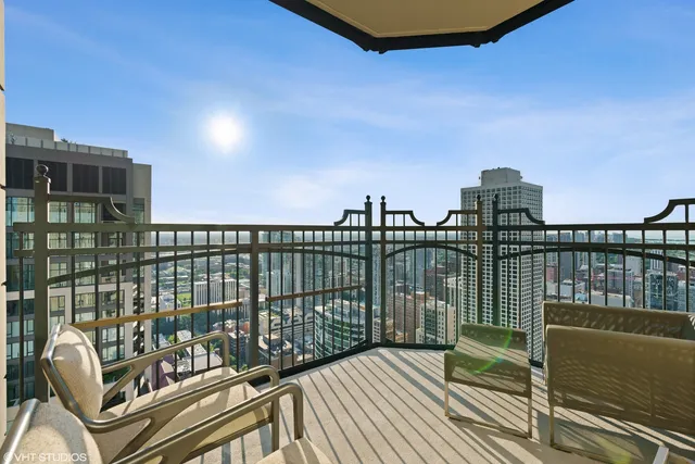 a view of a balcony with furniture