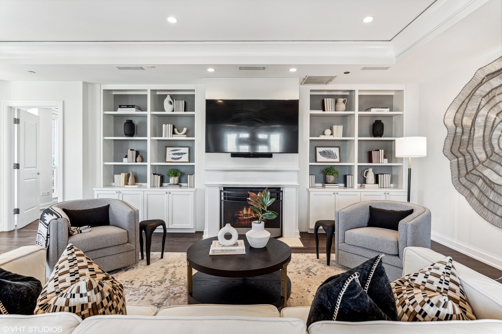 11 East Walton Street, Unit 4202 Chicago, IL 60611 - Photo 5 of 48 a living room with furniture a flat screen tv and a fireplace